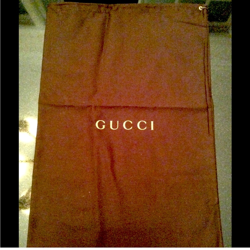 Brown Gucci drawstring bag